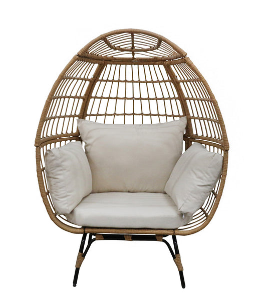 Wicker egg-shaped chair with white cushions on a white background