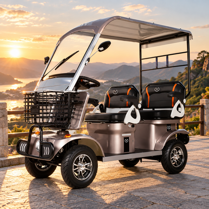 Coffee-coloured electric mobility aid with canopy, windscreen and front basket on a paved lookout at sunset