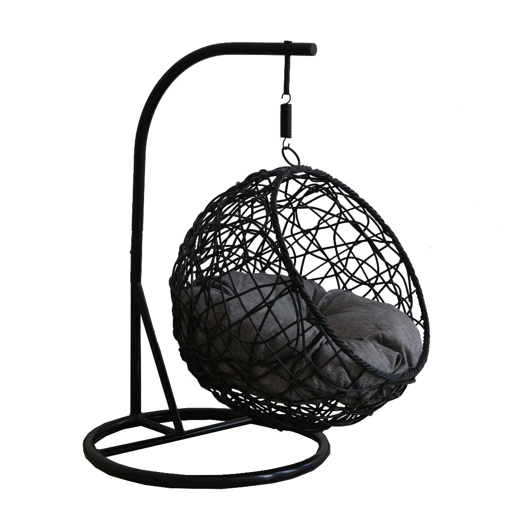 Black woven hanging chair with a gray cushion on a white background