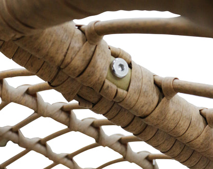 Close-up of a beige woven material with a metal screw, on a white background