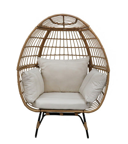 Wicker egg-shaped chair with white cushions on a white background