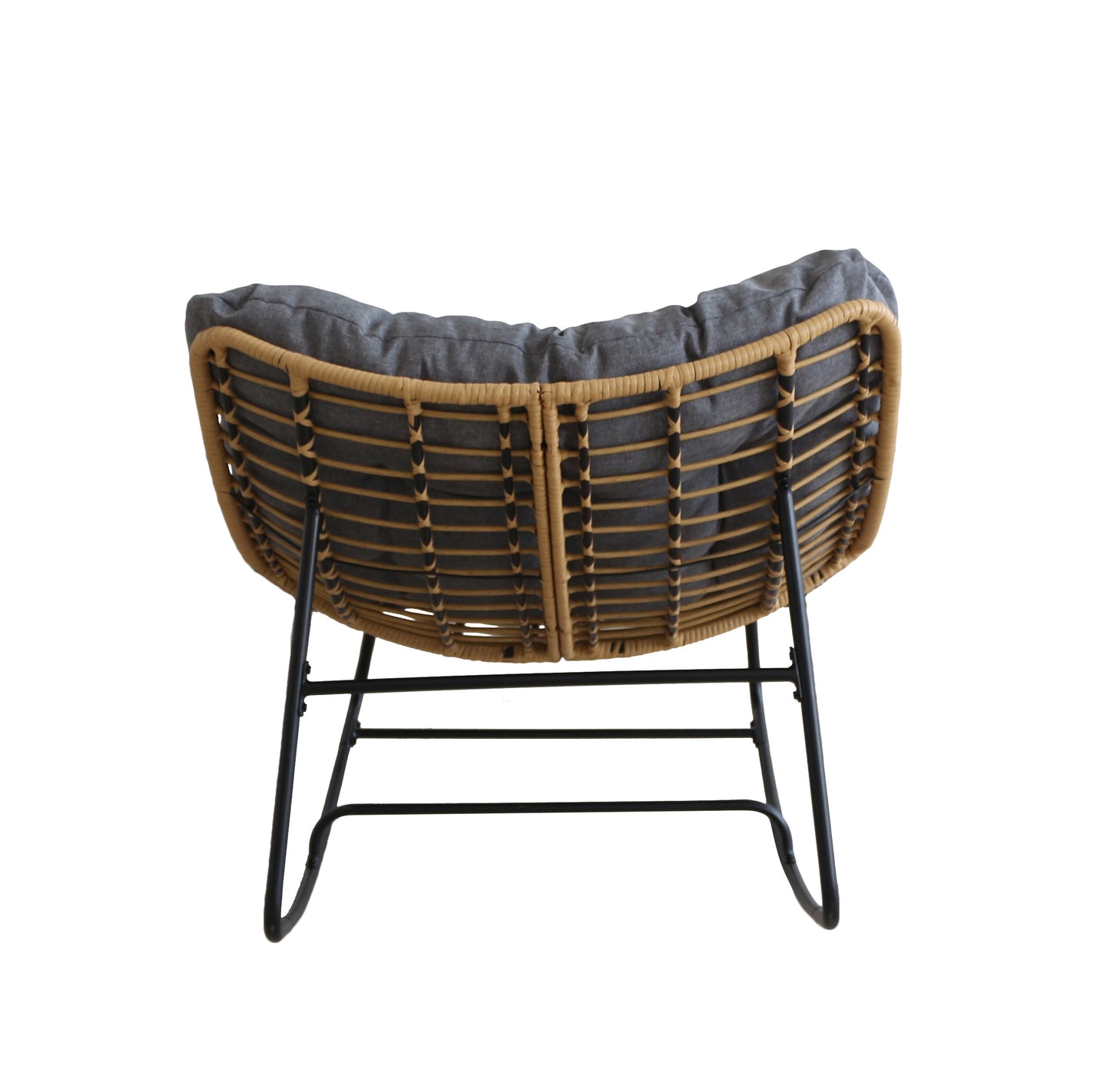 Wicker chair with a dark cushion on a white background