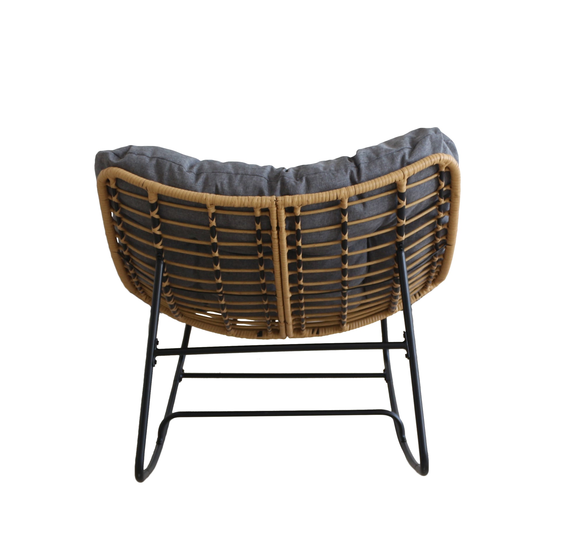 Wicker chair with a dark cushion on a white background