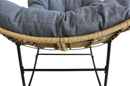 Close-up of a wicker chair with a gray cushion on a white background