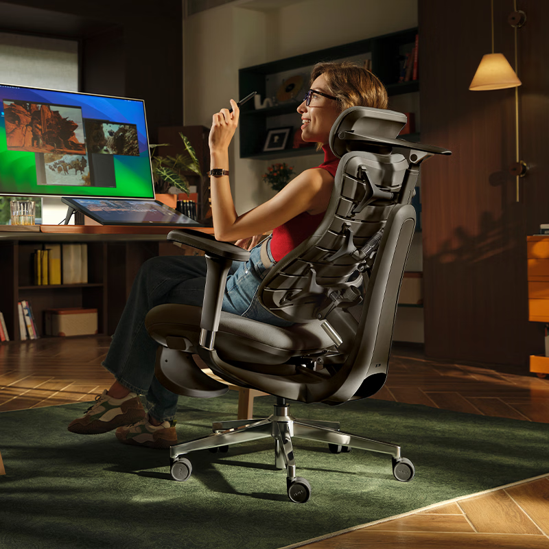 Hbada T8 Max black office chair in a home office, reclined with keel backrest visible