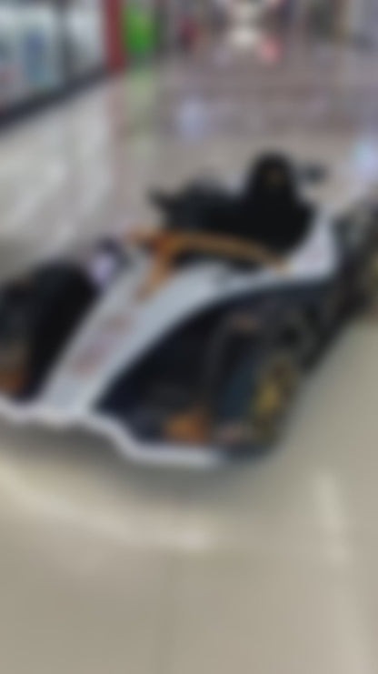 Urban Culture Homes 12V 7Ah Dual Drive Electric Go-Kart | Kids Racing Vehicle with Remote Control, MP3, and LED Lights